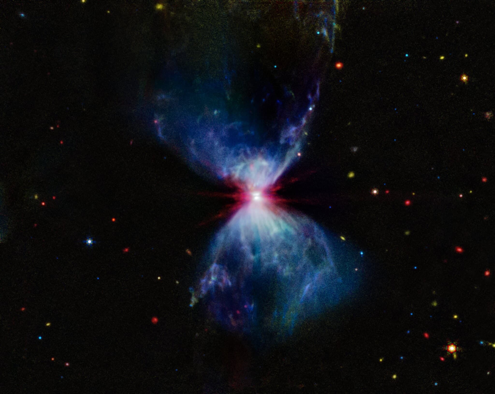 Webb image of celestial fireworks of gas and light around a forming star.