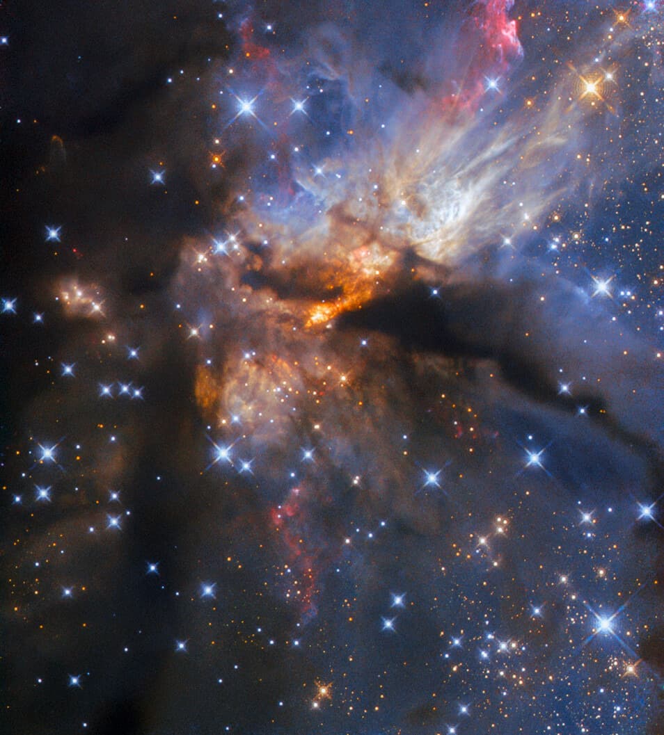 A powerful protostellar jet from the high-mass star-forming region G35.2-0.7N carving a glowing orange cavity through surrounding dark dust clouds.