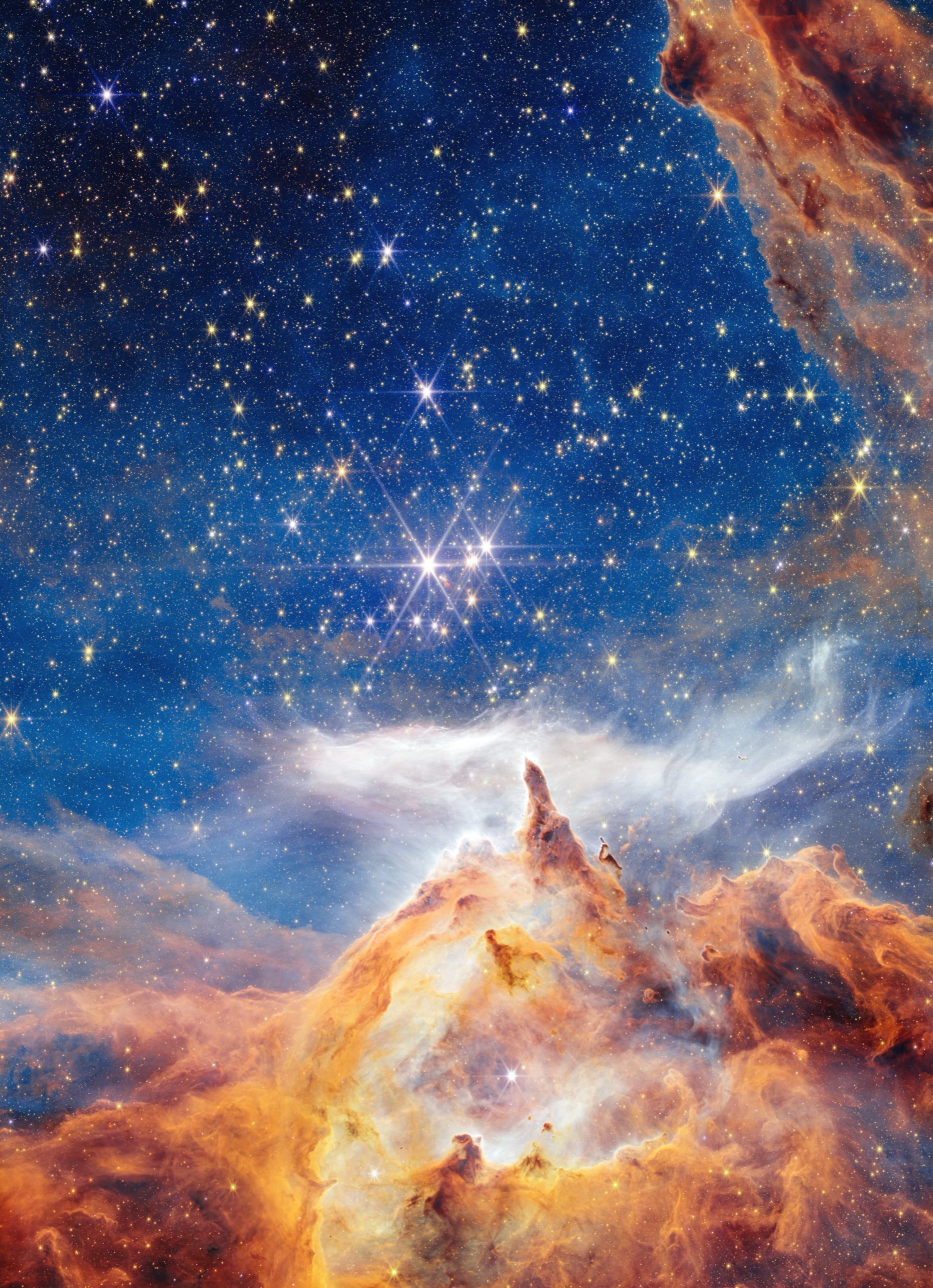 Webb view of a glittering star-birth region dense with young stars.